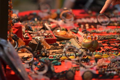 Close-up of old antique jewelries on table