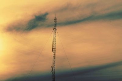 Low angle view of tower against sky during sunset