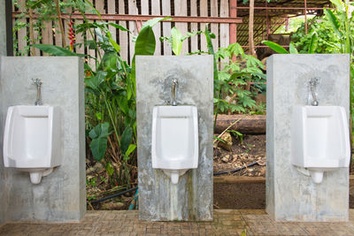 Urinals on concrete blocks outdoors