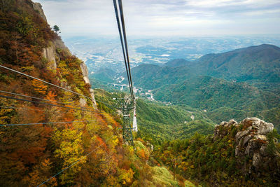 High angle view of trees and mountains against sky