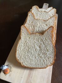 High angle view of bread on cutting board