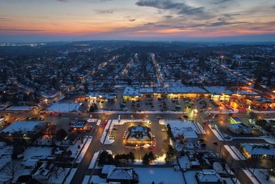 Drone photo of city streets at dusk in winter