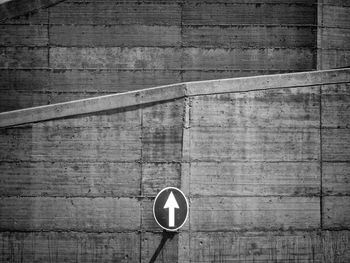 Arrow sign on wall