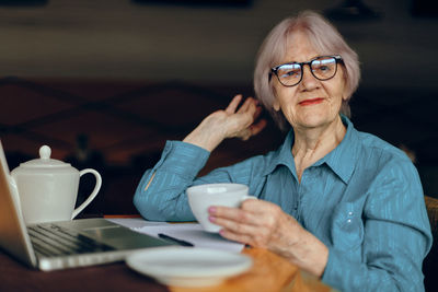 Senior businesswoman sitting at cafe