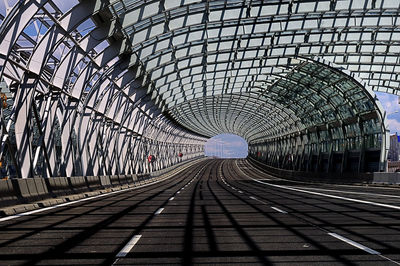 Empty railroad tracks in tunnel