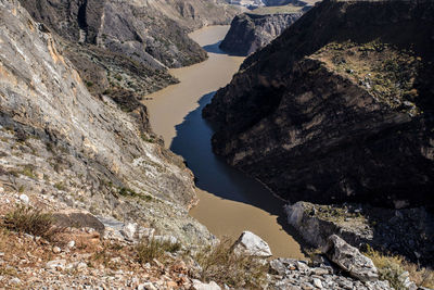 High angle view of rocks by river