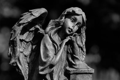 Close-up of statue in cemetery