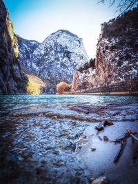 Scenic view of lake against clear sky during winter