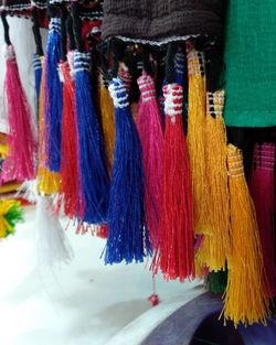 Close-up of multi colored umbrellas hanging at market