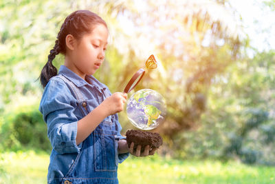 Girl holding plant