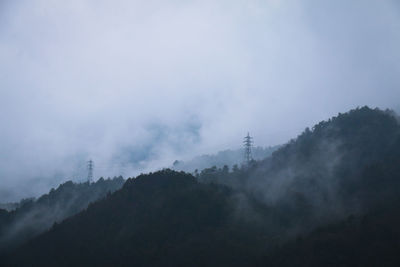 Scenic view of mountains in foggy weather