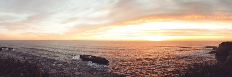 Scenic view of sea at sunset