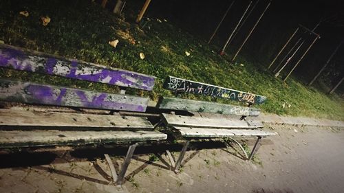 Car parked at illuminated railroad tracks