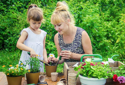 Side view of boy gardening in farm