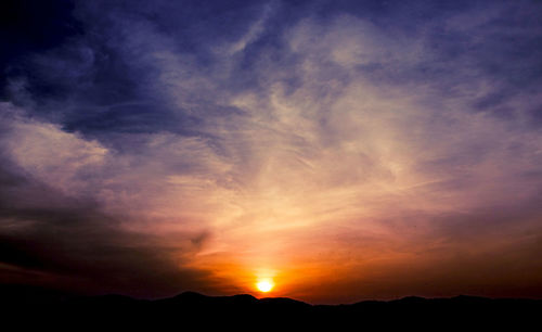 Low angle view of dramatic sky during sunset