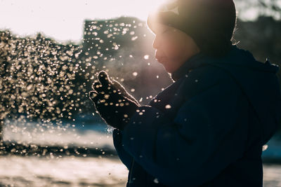 Side view of man in park during winter