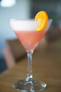 Close-up of martini served on table