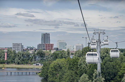 View from a ropeway gondola over the floriade expo with the city center in the background