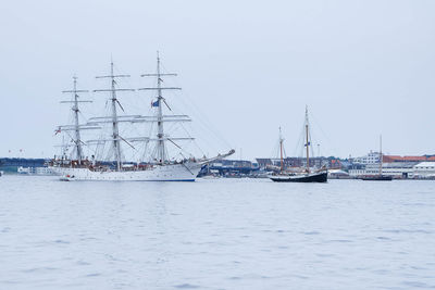 Boats sailing at harbor