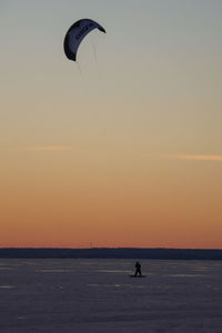 Silhouette of people at sunset