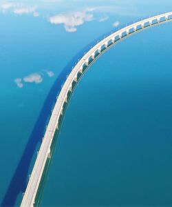 Tilt image of bridge against blue sky