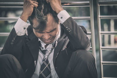 Close-up of woman standing in bus