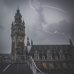 Lightning over clock tower during rainy season