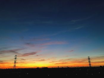 Silhouette landscape against sky during sunset