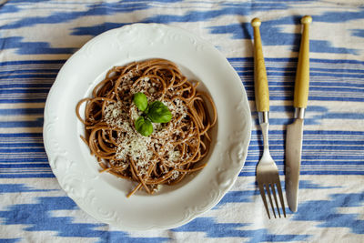 High angle view of pasta in plate on table