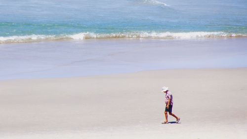 Man walking on beach