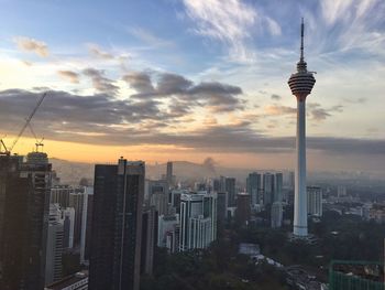 City skyline against cloudy sky