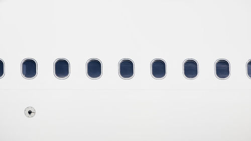 Windows on fuselage of airplane. white plane with copy space.