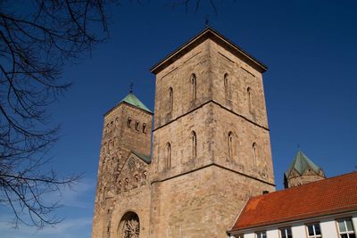 Low angle view of building against clear blue sky
