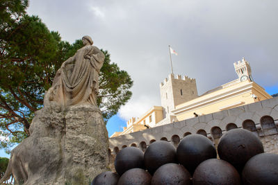 Low angle view of statues against building