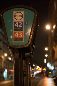 Cars on city street at night