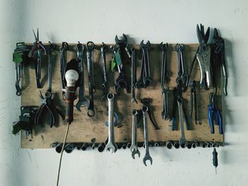 Row of clothes hanging on wall