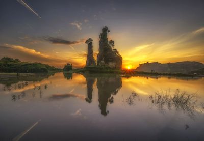 Scenic view of lake against sky during sunset