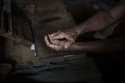 Cropped image of hands on table at workshop