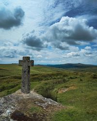Built structure on field against sky