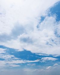 Low angle view of airplane flying in sky