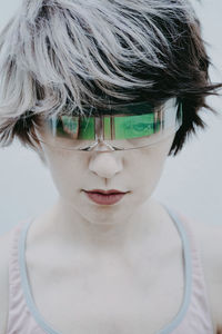 Androgynous woman wearing futuristic glasses