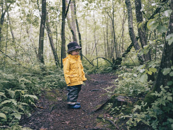 Toddler walking in forest