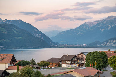 High angle view of townscape by mountains against sky