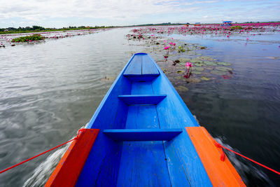 High angle view of boat in lake against sky