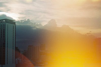 Scenic view of buildings against sky during sunset