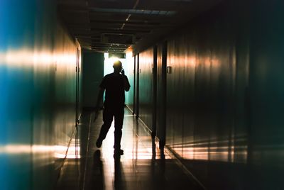 Man standing in corridor