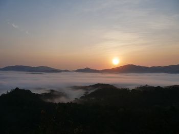 Scenic view of silhouette mountains against sky during sunset