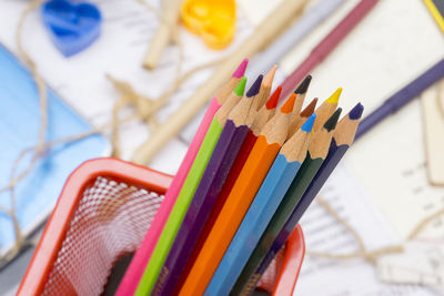 Close-up of colored pencils in container