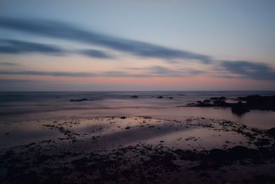 Scenic view of seascape against sky during sunset