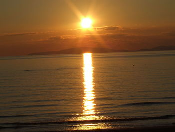 Scenic view of sea at sunset